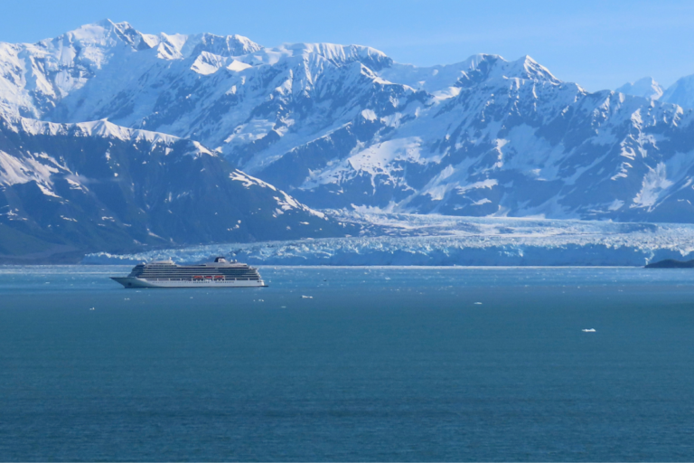 Hubbard Glacier in Alaska with a cruise ship in front of the glacier.