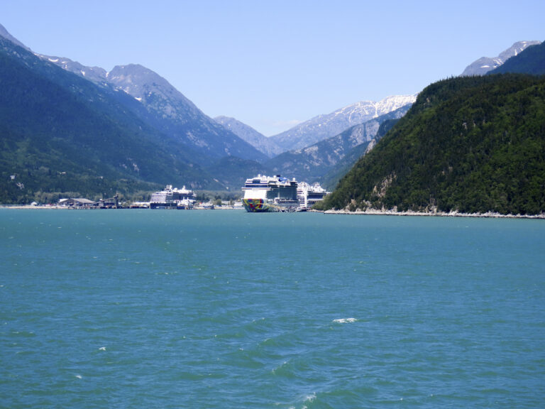 Cruise ships in Skagway, Alaska, surrounded by mountains and water